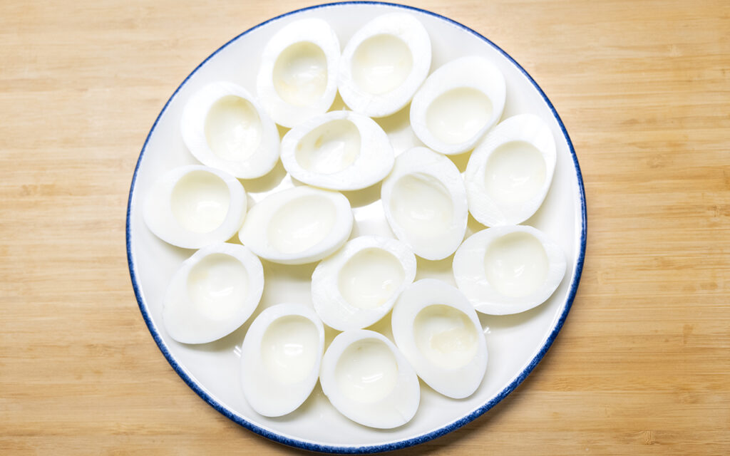 Cooked egg white halves with yokes removed